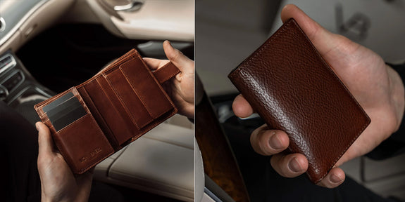 man in suit holding Von Baer bifold wallet