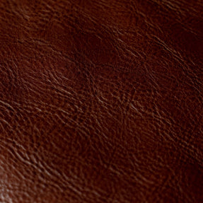 Close-up of a large-grain textured Cuoio Superiore full-grain leather, naturally structured and vegetable-tanned, highlighting the quality and organic patterns.