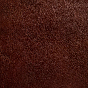 Close-up of a medium-grain textured Cuoio Superiore full-grain leather, naturally structured and vegetable-tanned, highlighting the quality and organic patterns.