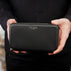 Von Baer W2 luxury RFID men’s leather wallet in black held by a male model, premium wallet for cards and cash.