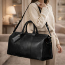 Von Baer Weekender full-grain leather bag for women in black in a luxury interior, elegant travel bag for weekend trips.