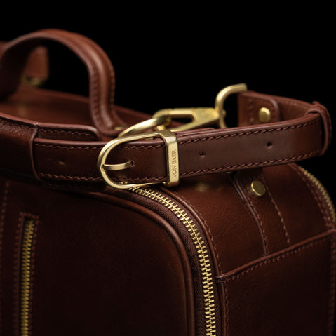 Von Baer 10x women's high-quality leather laptop travel bag in brown, featuring adjustable straps.