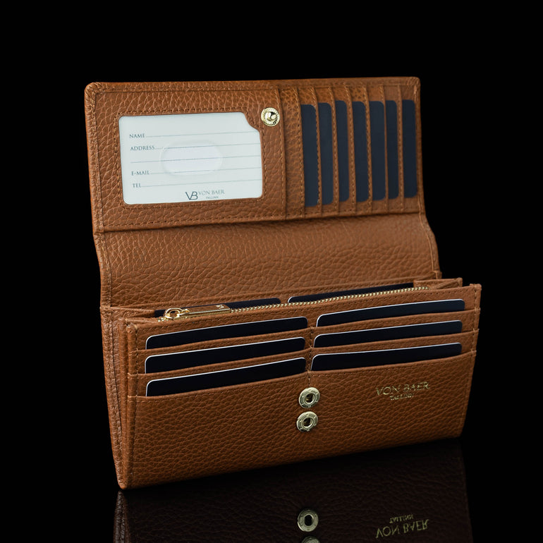 Von Baer Allure large cognac tan full-grain leather accordion wallet with RFID protection, shown open and filled with cards to highlight card slots and an ID window against a black background.