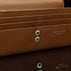 Von Baer Allure large cognac tan full-grain leather accordion wallet with RFID protection, shown in a close-up highlighting the snap button closure.