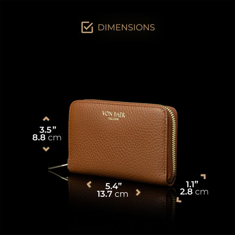 Von Baer Celeste small tan full-grain leather zip-around purse shown in a half-turned view with dimensions, highlighting its compact size and gold-embossed Von Baer Tallinn branding against a black background.