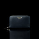 Von Baer Celeste small navy blue full-grain leather zip-around wallet with gold-tone branding, displayed in a front view against a black background.