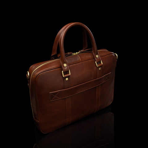 Von Baer City Business Leather Laptop Bag in brown with a luggage strap, back view.