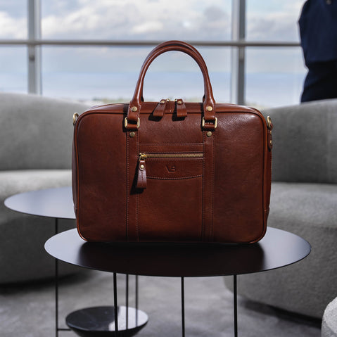 Von Baer City Business Leather Laptop Bag in brown, on the table in the president suite.