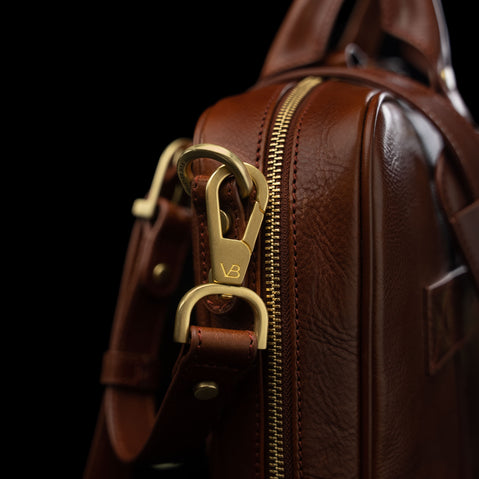 Von Baer City Business Luxury Leather Laptop Bag in brown with solid brass details, close-up view.