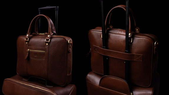 Von Baer City leather laptop bag for travel, featuring a luggage strap on trolley luggage