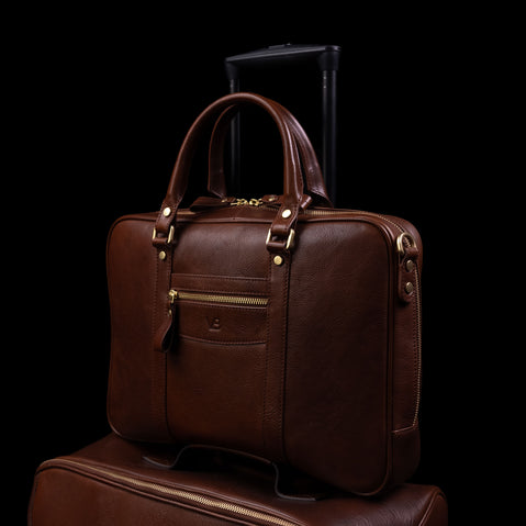 on Baer City leather laptop bag for travel with a luggage strap on trolley luggage