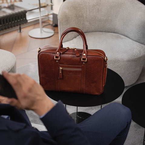 Von Baer City Luxury Leather Laptop Bag in brown, on the table in the president suite.