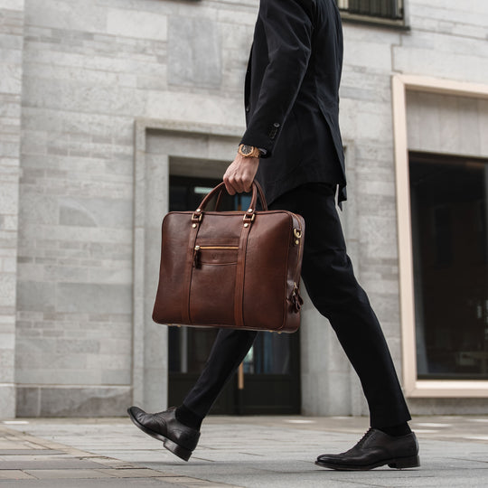 von baer city top luxurious large leather mens laptop bag for lawyer carried by man in a suit