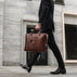 von baer city top luxurious large leather mens laptop bag for lawyer carried by man in a suit