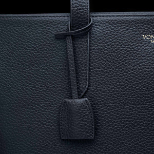 Von Baer decorative leather clip with snap hook in navy blue color on tote bag, front view 