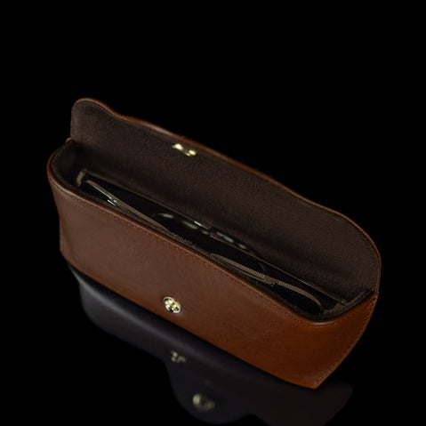 An upper view of a brown Von Baer Deluxe luxury leather glasses case for women, with glasses inside.