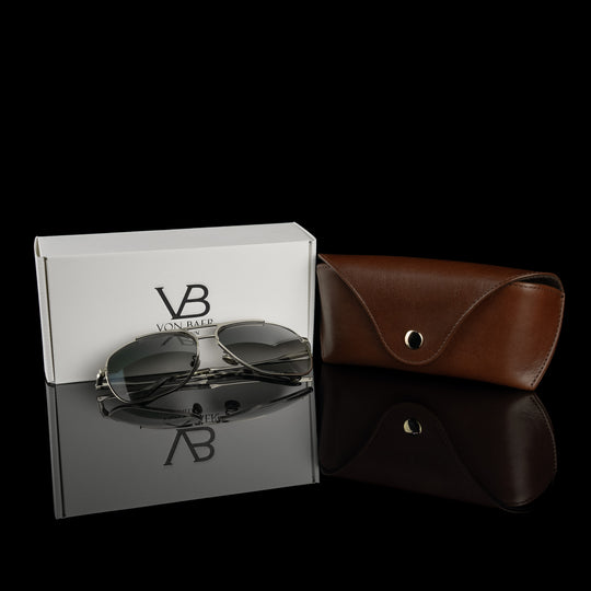 A brown Von Baer Deluxe luxury leather glasses and sunglasses case for women, with a gift box and glasses.
