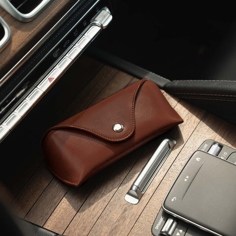 A brown Von Baer Deluxe luxury leather sunglasses and glasses case in a car, an ideal gift for women.