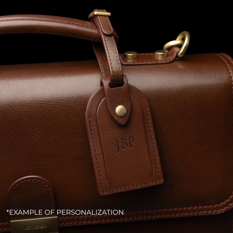 Von Baer diplomat men’s compact full-grain leather briefcase luggage tag close-up with personalized embossed initials.
