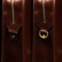 Von Baer Elegant high-quality slim full-grain leather laptop bag in brown, half-turned side view with brass rings for men.