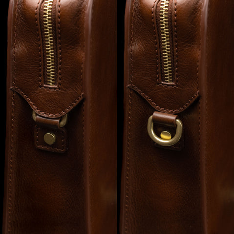 Von Baer Elegant high-quality slim full-grain leather women’s laptop bag in brown, half-turned side view with brass rings.