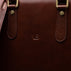 Men’s Von Baer Elegant high-quality slim full-grain leather laptop bag in brown, showcasing the VB logo close-up and leather texture.