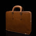 Men’s Von Baer elegant high-quality slim full-grain leather laptop bag in tan, half-turned.