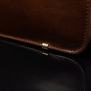 Men’s Von Baer Elegant high-quality slim full-grain leather laptop bag in brown, featuring protective metal feet close-up.