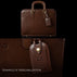 An elegant Von Baer leather laptop bag showing an example of personalization with embossed initials on the attached luggage tag.