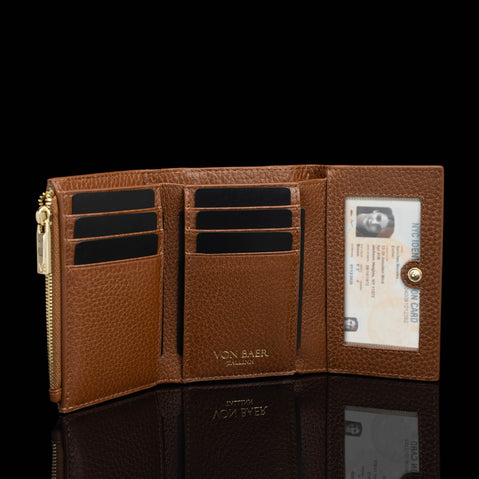 Von Baer Elise women's cognac trifold leather wallet displayed open to reveal multiple card slots and an interior ID window.