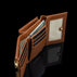Von Baer Elise women's cognac leather trifold wallet displayed open against a solid black background, showcasing its multiple card slots, cash compartments, and transparent ID window.