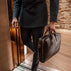 von baer essential leather laptop bag black attorney coming into the luxurious elevator