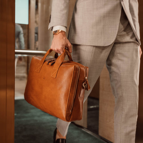 von baer essential leather laptop bag tan attorney coming out of luxurious elevator