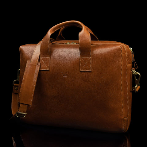 von baer essential modern italian leather briefcase for men classic tan half side view with shoulder strap