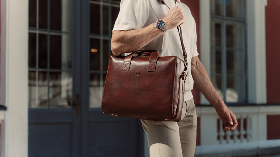 von baer essential modern quality leather briefcase brown with shoulder strap carried by businessman slider