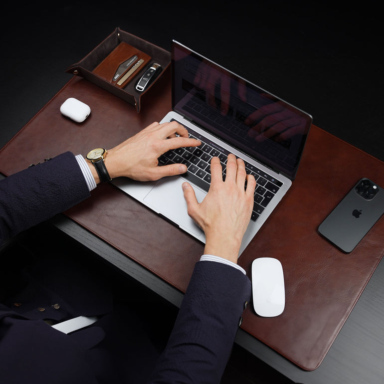 Von Baer Executive large brown leather desk pad and laptop mat upper view used by man in suit working on MacBook