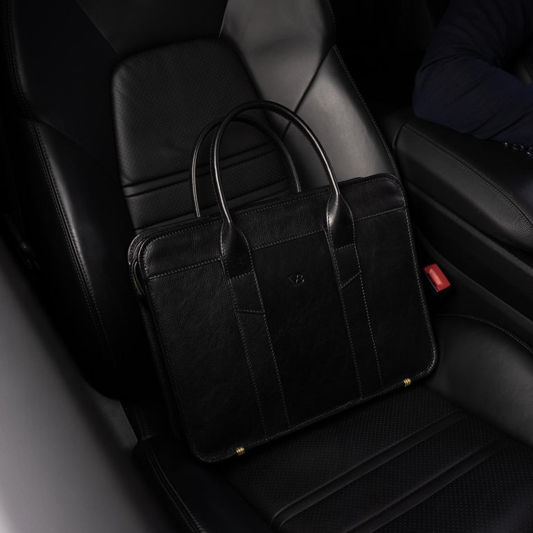 Von Baer Exquisite luxury slim full-grain leather laptop bag on seat of Porsche car