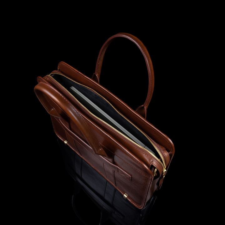 Von Baer Exquisite luxury full-grain leather laptop briefcase for women in brown, with a MacBook inside.