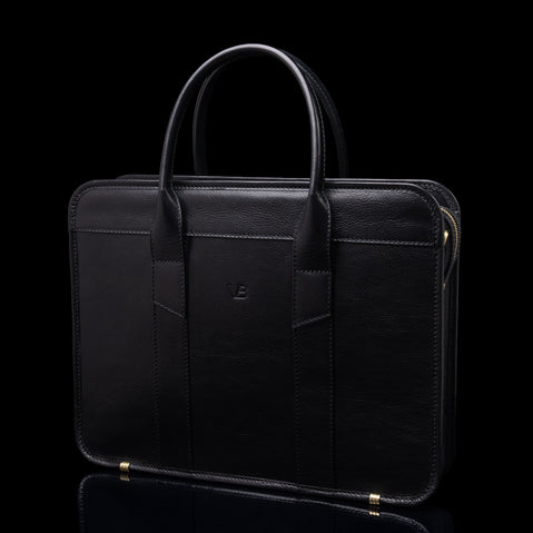 Von Baer exquisite luxury full-grain leather laptop briefcase for women and men in black color, half-turned 3D view.