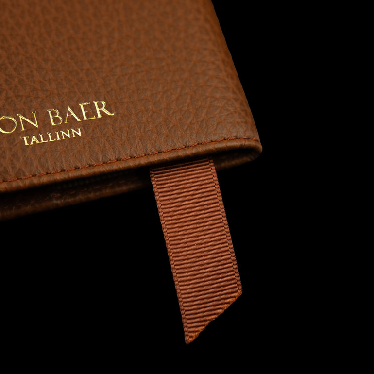 Von Baer full grain leather passport cover holder with grosgrain page marker, close-up view