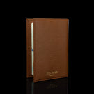 Von Baer full grain leather passport cover holder, half-turned view on a black background