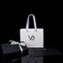 Von Baer luxury gift packaging displayed alongside Allure large leather accordion wallets, a travel organizer, and a leather luggage tag.