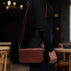 Von Baer Isabella luxury mini leather crossbody bag worn on the shoulder of a female model.