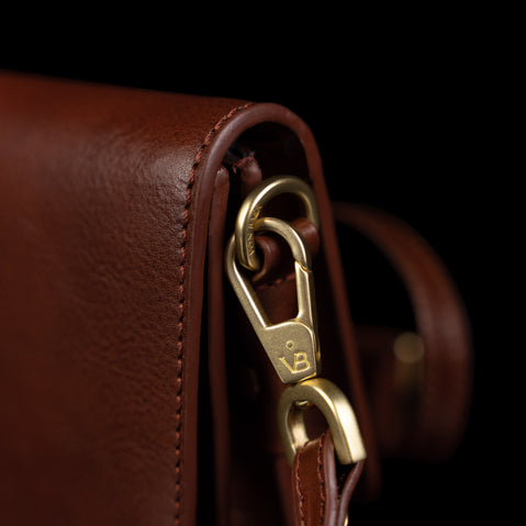 Von Baer Isabella luxury mini leather crossbody bag, showcasing high-quality brass hardware close-up.