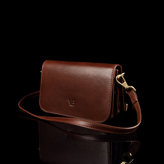 Von Baer Isabella luxury mini leather crossbody bag with adjustable strap in brown color.