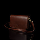 Von Baer Isabella luxury mini leather crossbody bag with adjustable strap in brown color.