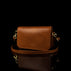 Von Baer Isabella luxury mini leather crossbody bag with adjustable strap in tan color.