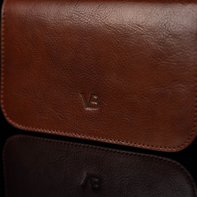 Von Baer Isabella luxury small full-grain leather shoulder bag with adjustable strap in brown, featuring the Von Baer logo.