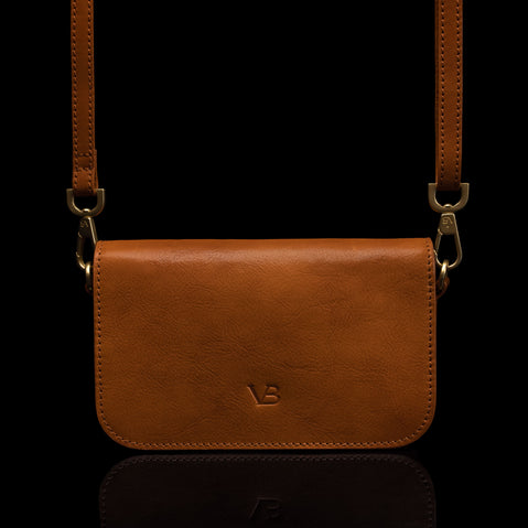 Von Baer Isabella luxury small leather shoulder bag with adjustable strap in tan, front view.
