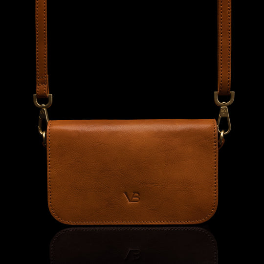 Von Baer Isabella luxury small leather shoulder bag with adjustable strap in tan, front view.